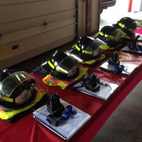 Helmets, gear and materials laid out at the station, ready for our newest bunk-in students.