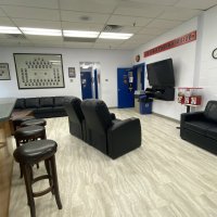 Another view of the day room, decorated with framed photos from around the department.